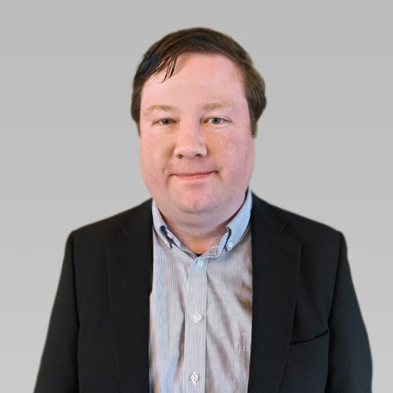 PCA Employee Brian Schmidt on a grey background