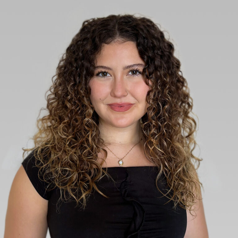 PCA Employee Emily McCarthy on a grey background