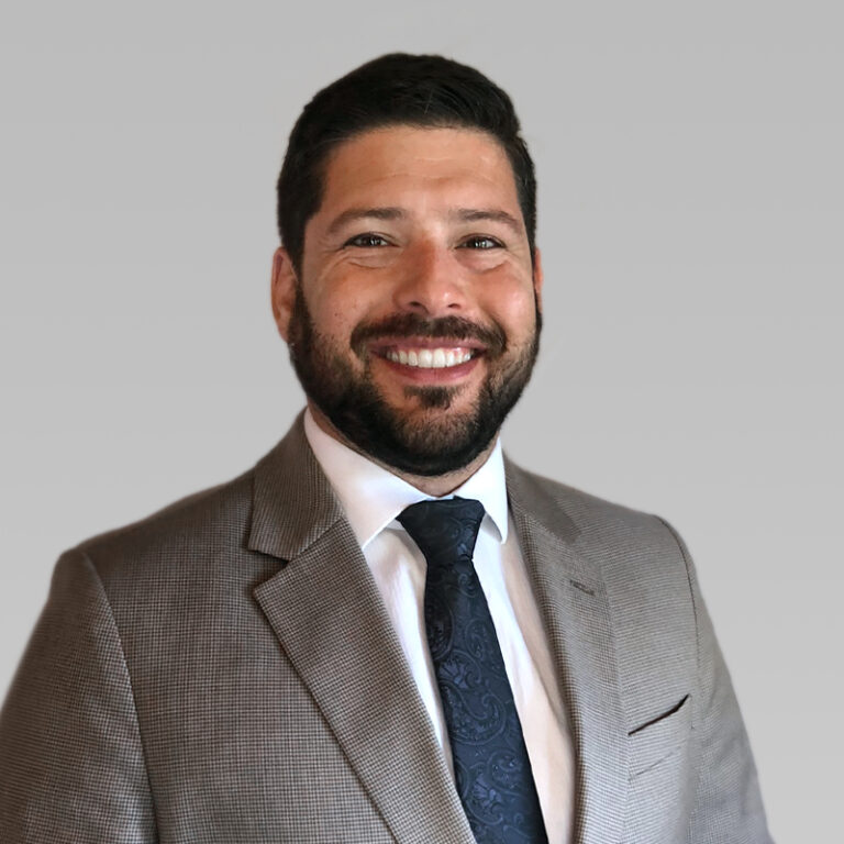 PCA Employee Josh Gilman on a grey background