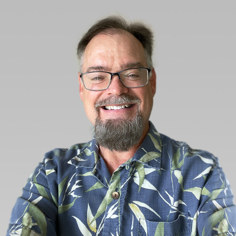 PCA Employee Paul Tennis on a grey background