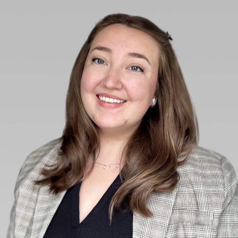 PCA Employee Sydney Huff headshot on a grey background